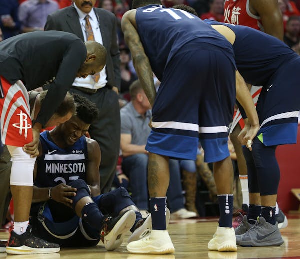 Timberwolves guard Jimmy Butler injured his right knee during the third quarter of Friday's game in Houston.