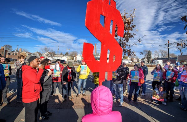 Supporters of the $15 minimum wage for St. Paul rallied in front of Walmart in the Midway area of St. Paul in November.
