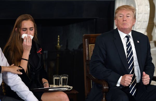President Donald Trump with Julia Cordover, Marjory Stoneman Douglas High School student body president, who got emotional during a meeting with stude
