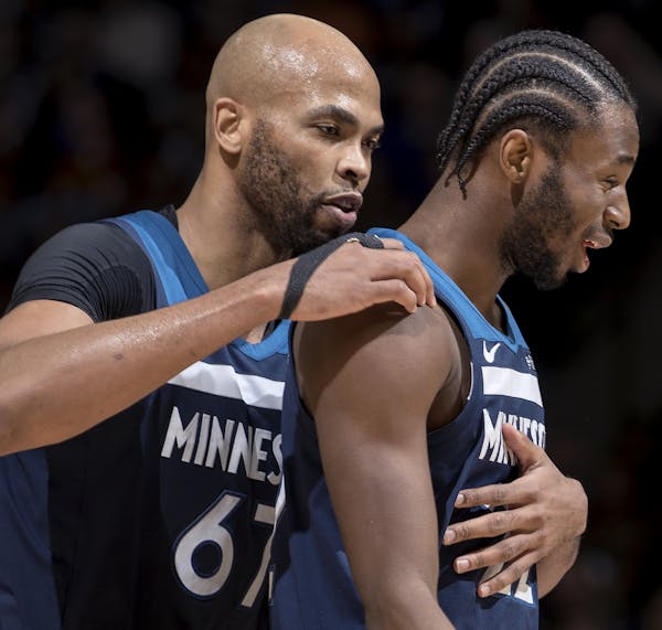 Taj Gibson, left, and Andrew Wiggins are two of the three Wolves who have started every game this season. “The fatigue is there,” Gibson says, ref