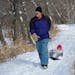 Lewis Soukup hauled his 9-month old granddaughter Audrey in a sled as they walked the trails at Wood Lake Nature Center in Richfield.