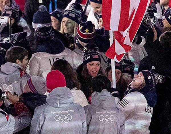Jessie Diggins carried the flag for team USA at Closing Ceremony on Sunday night. ORG XMIT: MIN1802251126030952