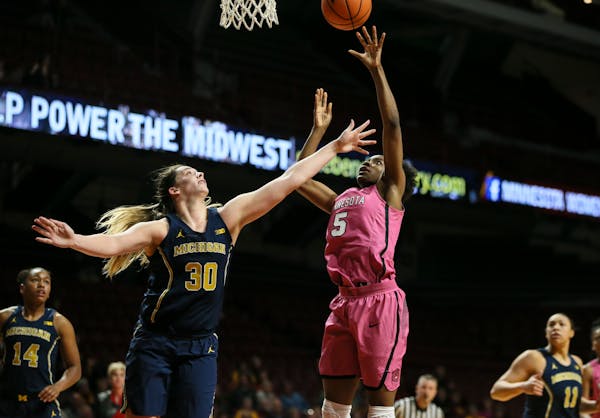 Gophers forward Taiye Bello (5, shown against Michigan earlier this month) had 10 points and 16 rebounds — 12 on the offensive end — in just 20 mi