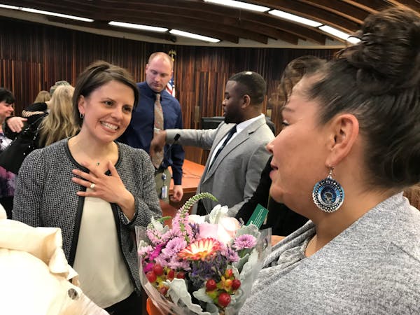 Marta Chou, left, the presiding judge for the Hennepin County Drug Court, congratulated Melissa Williams after the ceremony for 24 men and women gradu