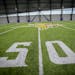 The Vikings indoor practice facility has artificial turf that is 100 feet below the ceiling, a clearance that allows for punting and kicking. It also 