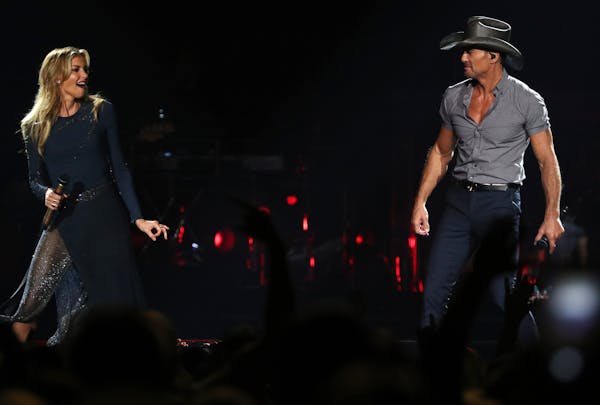 Country superstar couple Tim McGraw and Faith Hill performed together in St. Paul on Friday, the first of two nights of shows.