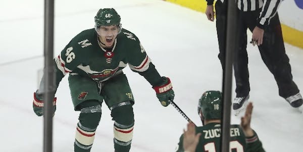 Wild defenseman Jared Spurgeon (46) headed for teammate Jason Zucker to celebrate his game-winning overtime goal against San Jose after converting a p