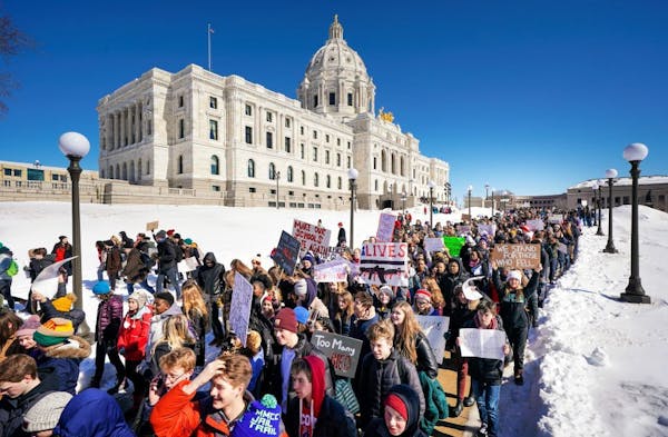 St. Paul high school students walked out of their schools and marched to the State Capitol on Wednesday to protest gun violence.