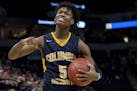 Quentin Hardrict (5) celebrated at the end of the game. Columbia Heights beat DeLaSalle 71-69. ] CARLOS GONZALEZ ï cgonzalez@startribune.com ñ March