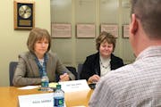 Sen. Tina Smith, D-Minn., listened to Paul Skrbec, 47, of Minneapolis, and others talk about the high price of prescription medications.