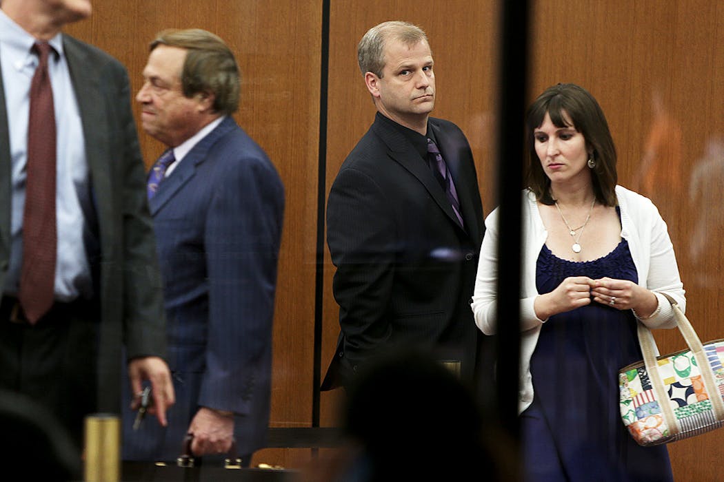 Jonathan Markle, center, made his way into the Hennepin County Government Center, Tuesday, June 25, 2013.