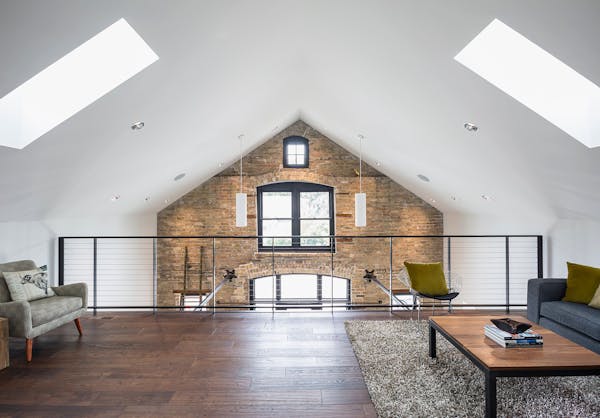 Sarah and Neil Amundsen created Hayloft Studios in a restored former livery stable in downtown Chaska. The couple use it as their party space and an e