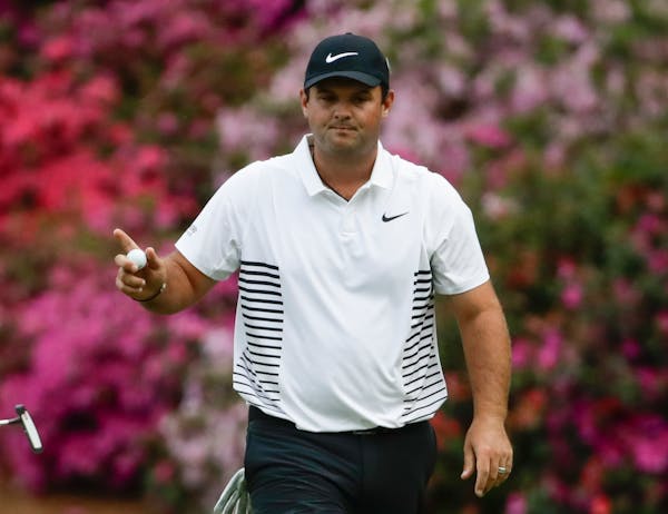 Patrick Reed reacts after making a birdie putt on the 13th hole during the second round at the Masters