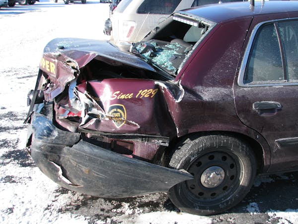 This Minnesota State Patrol vehicle was struck while an officer was on the side of the road assisting a motorist.