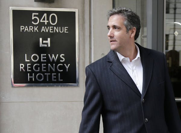 Michael Cohen returns to the hotel where he has been staying in New York, Wednesday, April 11, 2018.