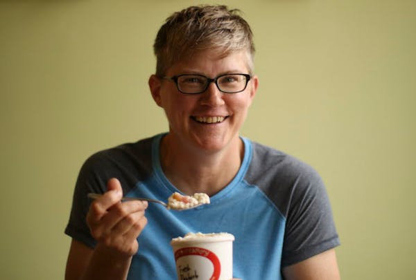Barb Zapzalka with a pint of her rhubarb ice cream at Pumphouse Creamery in Minneapolis.