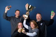 Castle Danger brewery owners (from left) Clint MacFarlane, Jamie MacFarlane, Mandy Larson and Lon Larson hoisted the trophy.