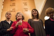 Holocaust survivors Renate Esquivel, center, and Reva Kibort, right, were accompanied by their granddaughters, Anna McCallum and Gracie Kibort, Thursd