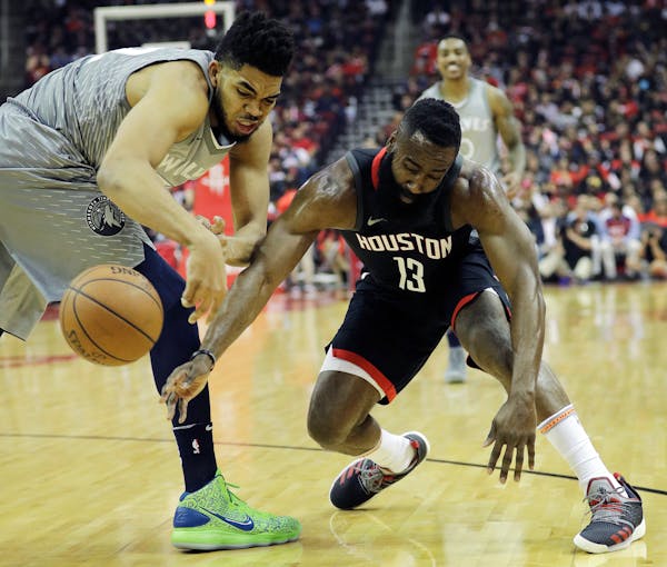 Wolves center Karl-Anthony Towns made 42.1 percent of his three-point attempts during the regular season — a stat well known to James Harden, right,