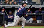Minnesota Twins' Brian Dozier (2) hits a fifth-inning, RBI single in a baseball game against the New York Yankees in New York, Monday, April 23, 2018.