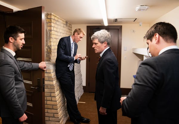 Richard Painter talked with staff before walking into a press conference to announce his candidacy for U.S. Senate as a Democrat.