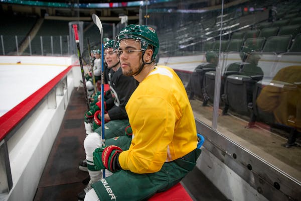 Wild left wing Jordan Greenway watched team drills prior to Game 1 of the playoffs.