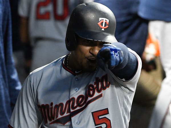 The Twins' Eduardo Escobar reacts in the dugout after hitting a home run against the Chicago White Sox on Friday.