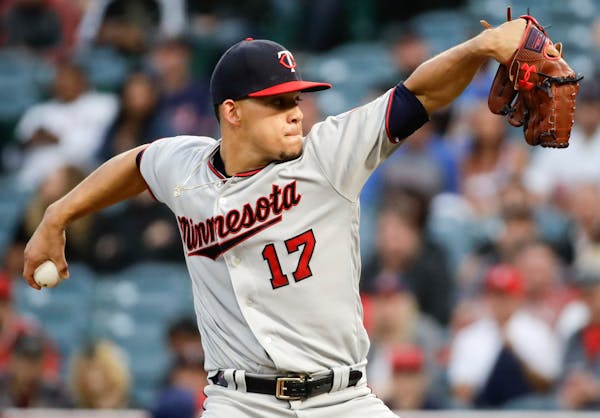 Minnesota Twins starting pitcher Jose Berrios throws to a Los Angeles Angels batter during the first inning of a baseball game in Anaheim, Calif., Thu