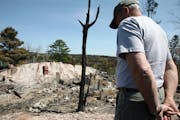 Bruce Kerfoot, owner of the Gunflint Lodge, surveyed the charred remains of a home after the 2007 fire.