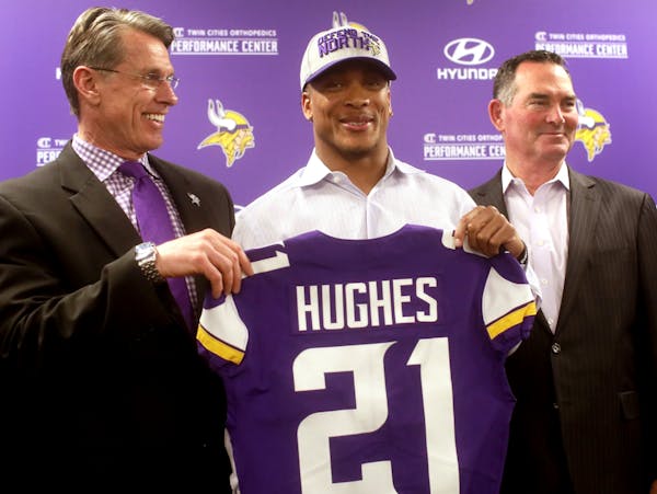 Vikings first round pick Mike Hughes with general manager Rick Spielman, left, and Vikings head coach Mike Zimmer