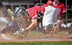 Lakeville North's Nick Juaire tagged out Anoka's Bowen Olson at home plate in the fourth inning during the Class 3A baseball quarterfinals at CHS Fiel
