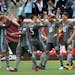 Minnesota United forward Christian Ramirez (21) was congratulated by his teammates after scoring on an outside shot in the first half.