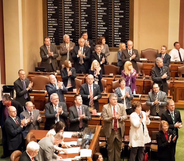 A joint session of the Minnesota Legislature egislature stood, applauded and looked toward the House gallery for the new Regent Randy Simonson but the