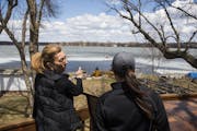 Melissa Hanson, left, shows Meghan Darley, a resource conservation technician with Scott Soil & Water Conservation District, the part of her lakeshore