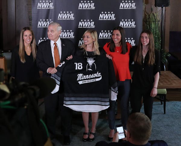 Gov. Mark Dayton posed for a photo with, from left, Whitecaps captain Winny Brodt Brown, league founder and commissioner Dani Rylan, and deputy commis