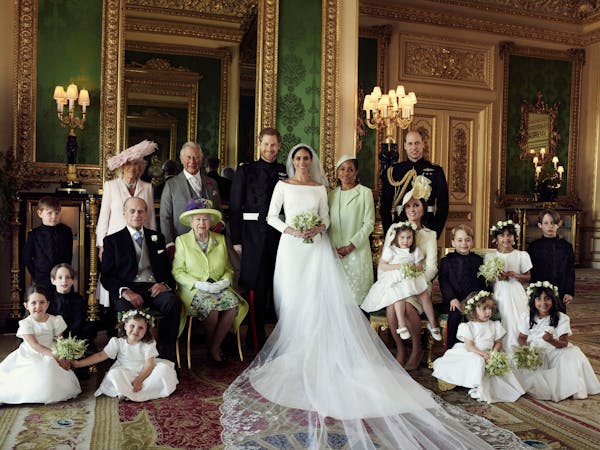 In this photo released by Kensington Palace on Monday May 21, 2018, shows an official wedding photo of Britain's Prince Harry and Meghan Markle, cente