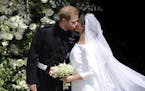 Britain's Prince Harry and Meghan Markle kiss as they leave after their wedding at St. George's Chapel in Windsor Castle in Windsor, near London, Engl