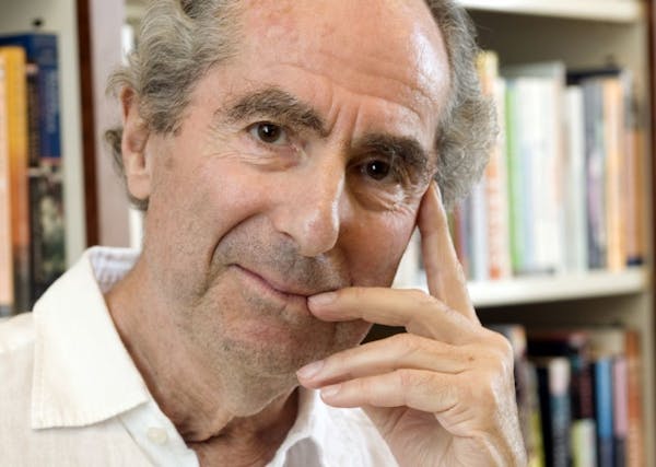 FILE - In this Sept. 8, 2008, file photo, author Philip Roth poses for a photo in the offices of his publisher, Houghton Mifflin, in New York.