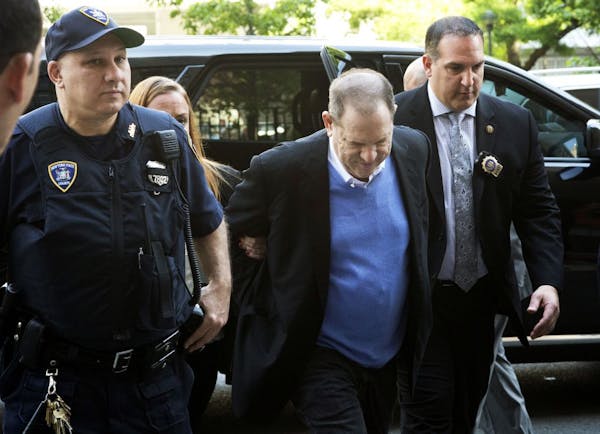 Handcuffed Harvey Weinstein arrives at court
