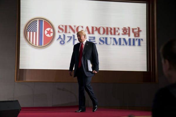 President Donald Trump at a news conference after meeting with Kim Jong Un of North Korea, on Sentosa Island in Singapore, June 12, 2018. Members of C