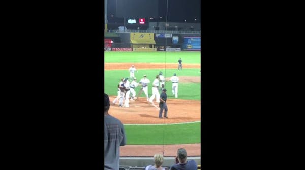 Pitcher hugs batter after game-ending strikeout