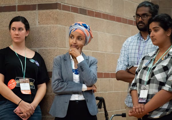 Rep. Ilhan Omar listened as State Sen. Patricia Torres Ray spoke. After the first ballot put State Sen. Patricia Torres Ray far behind Rep. Ilhan Omar