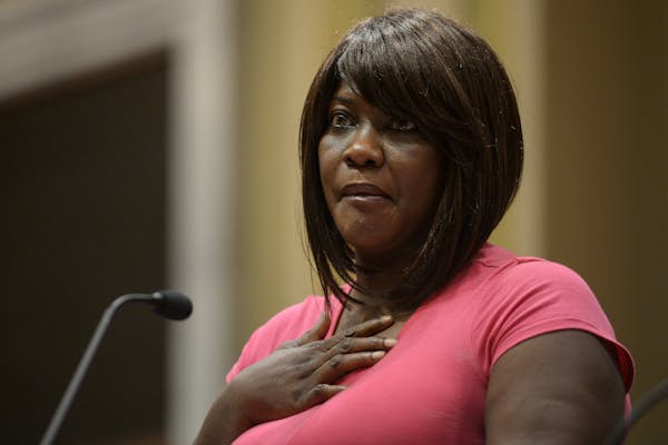 Minister Toya Woodland fought back tears as she made remarks concerning the Minneapolis Police Department's draft report on forced Ketamine use at Thu