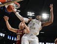 Florida State forward Brandon Allen (40) and Georgia Tech guard Josh Okogie (5) vie for a rebound during the second half of an NCAA basketball game We