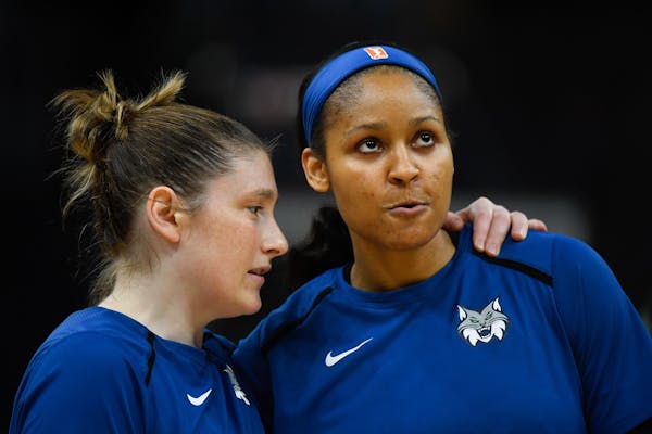 Minnesota Lynx guard Lindsay Whalen, left, talks with forward Maya Moore before a game earlier this week. Minnesota lost Saturday night in Chicago.