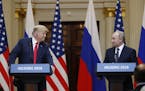 U.S. President Donald Trump, left, and Russian President Vladimir Putin arrive for a press conference after the meeting of U.S. President Donald Trump