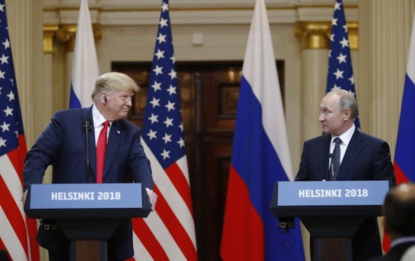 U.S. President Donald Trump, left, and Russian President Vladimir Putin arrive for a press conference after the meeting of U.S. President Donald Trump