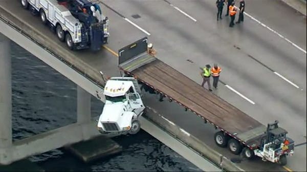 Truck dangles from Florida bridge near Tampa