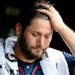 Minnesota Twins starting pitcher Lance Lynn (31) stands in the dugout after being relieved during the second inning of an baseball game against the Ch