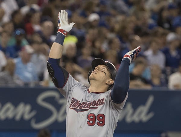 The Twins’ Logan Morrison crossed home plate after belting a home run in the fifth inning against the Toronto Blue Jays on Monday.